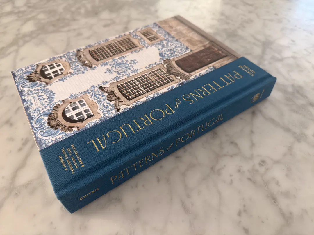 Patterns of Portugal by Christine Chitnis, blue hardcover with a tiled building