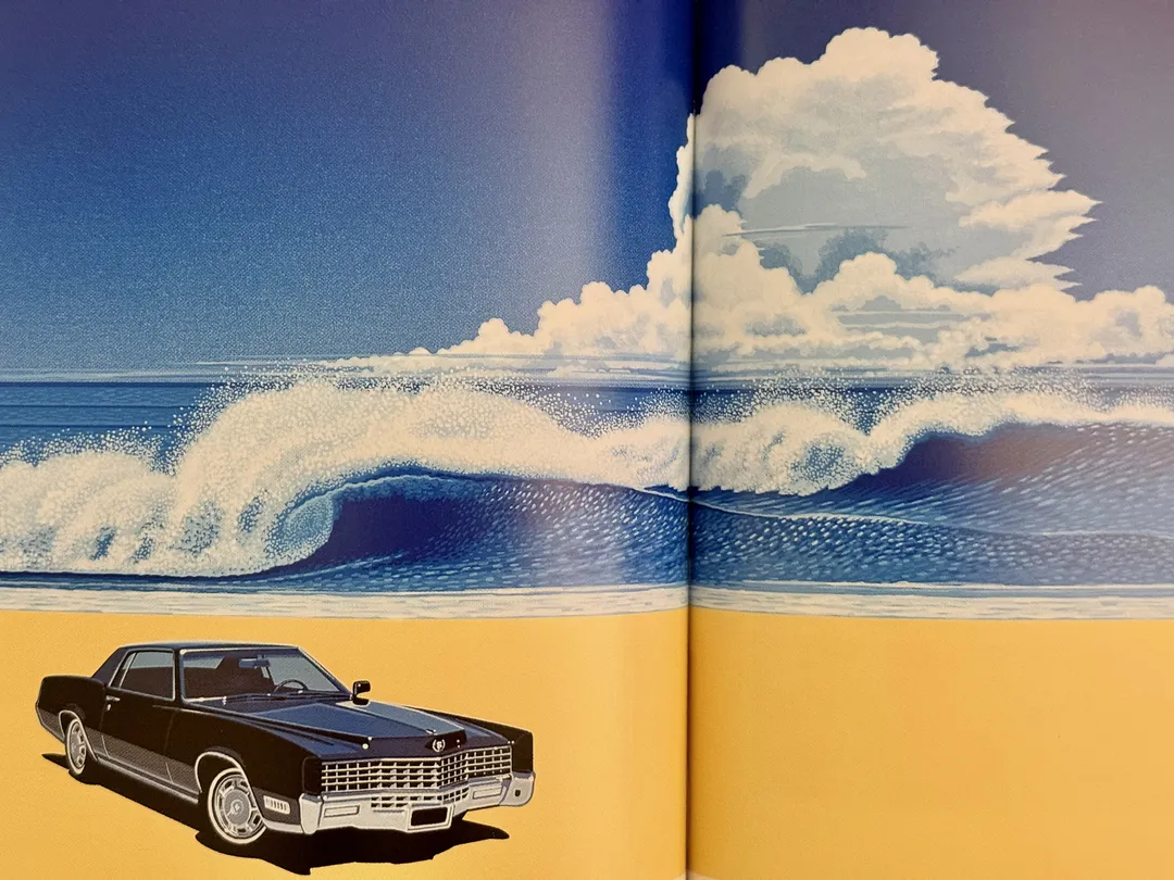 Black Cadillac on the sand beneath a breaking wave and towering clouds