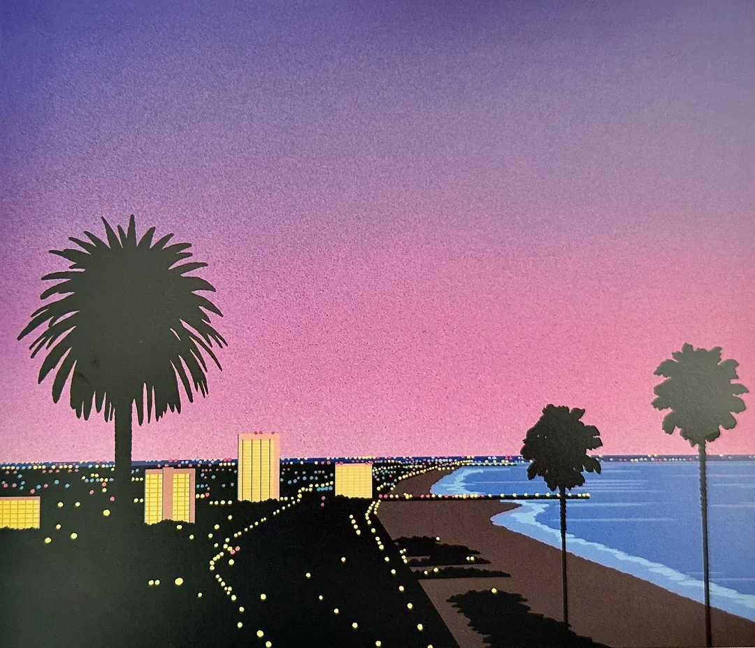 Pink dusk over a lit coastal city with palm silhouettes