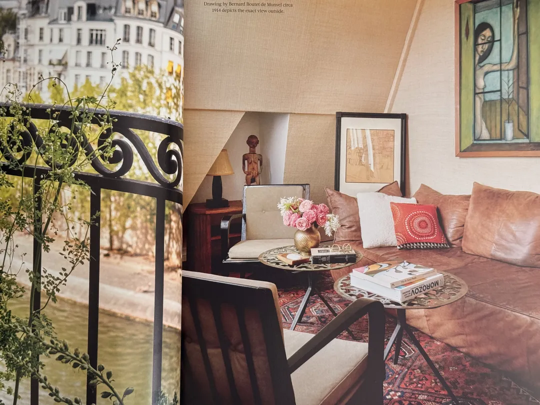 Paris apartment with a wrought-iron balcony and a cosy sofa nook